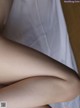 A close up of a woman's legs on a bed.